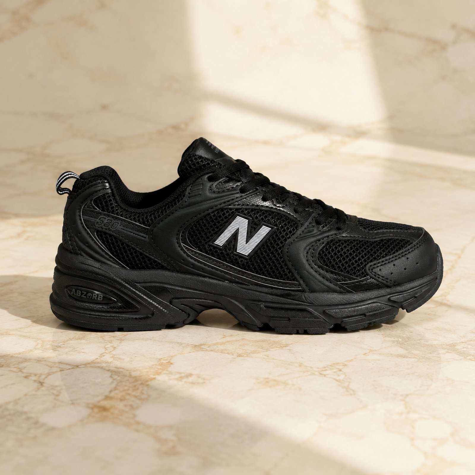 New Balance 530 Triple Black scene