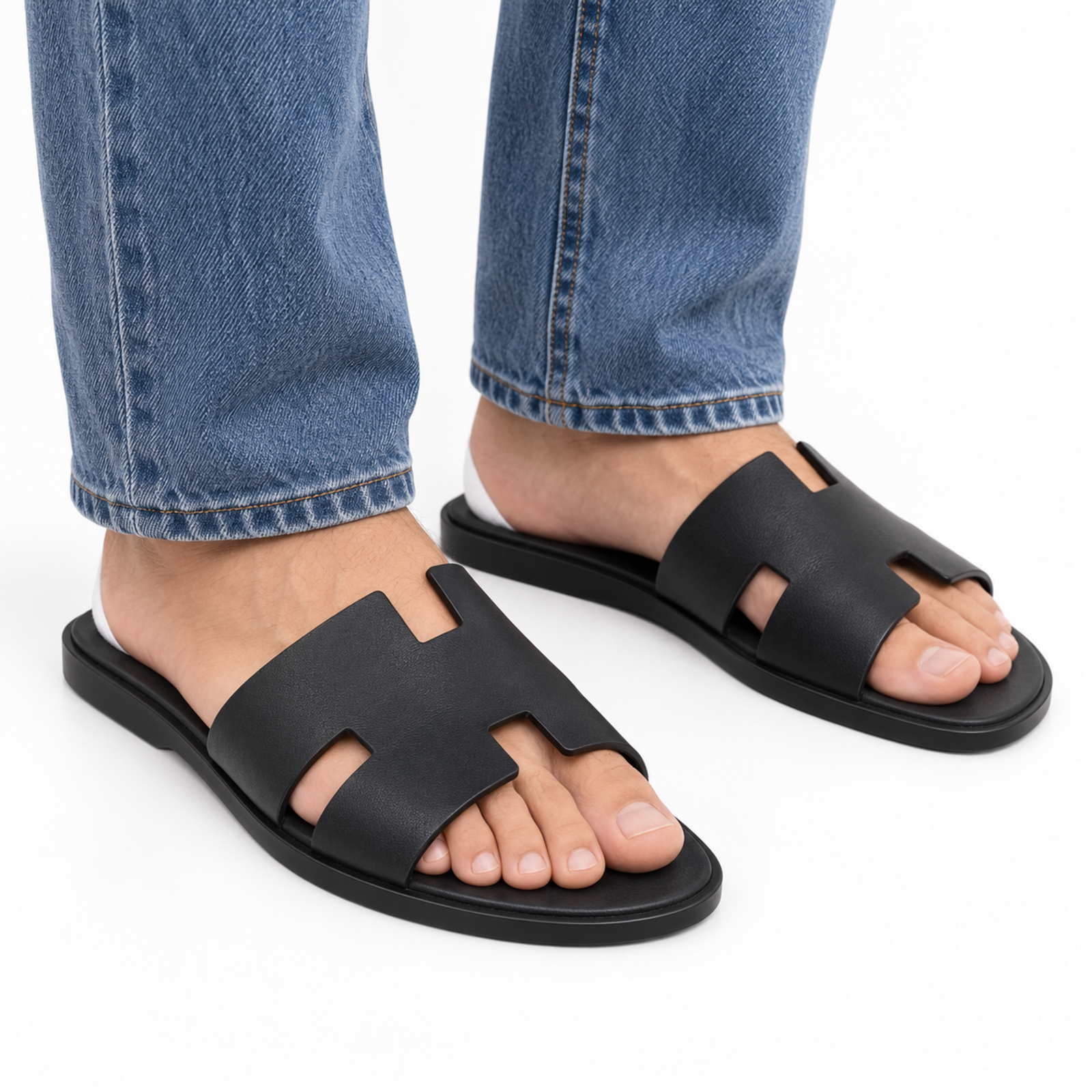 Hermes Izmir Sandal Black on foot